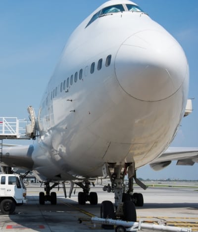 Large aircraft on stand getting loaded with air freight.