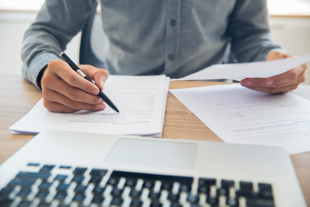 businessman checking documents at table